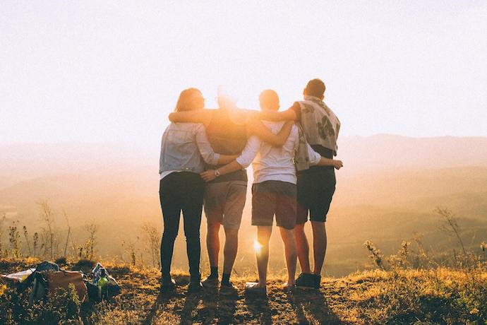 A group of friends with their arms around each other